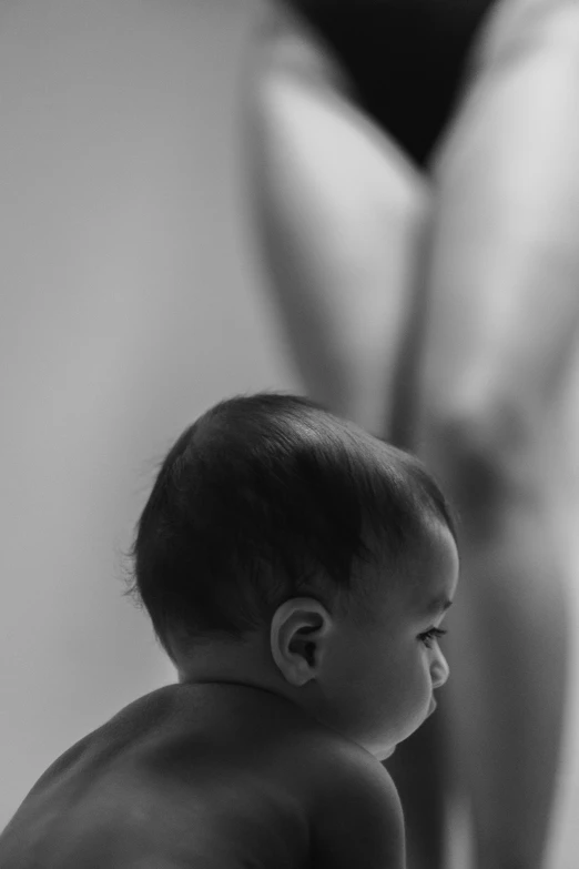 a  baby sitting on top of a bed