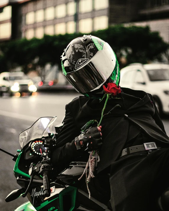 the person in the helmet is sitting on the motorcycle