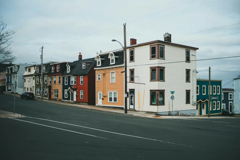 a row of houses with many windows and trim around them