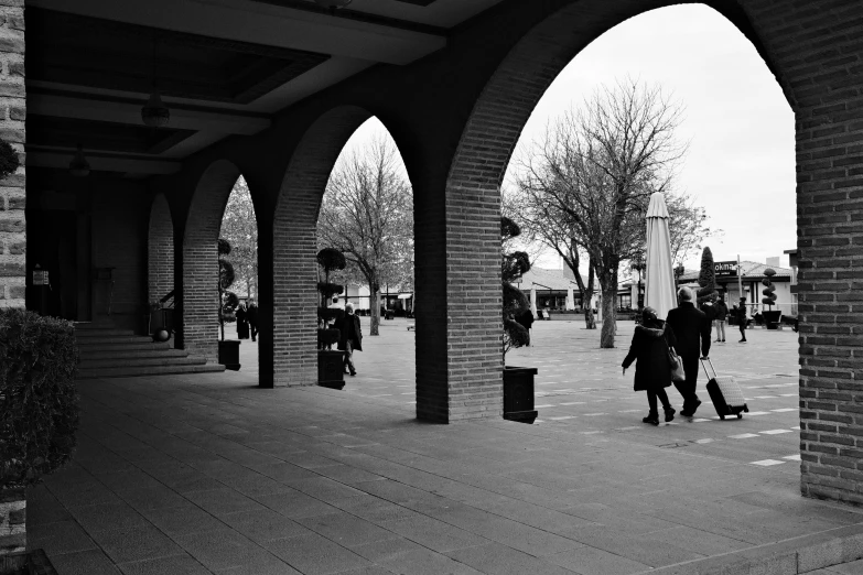 a group of people walking through a park