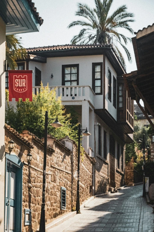 the side of a street with an old building in the background