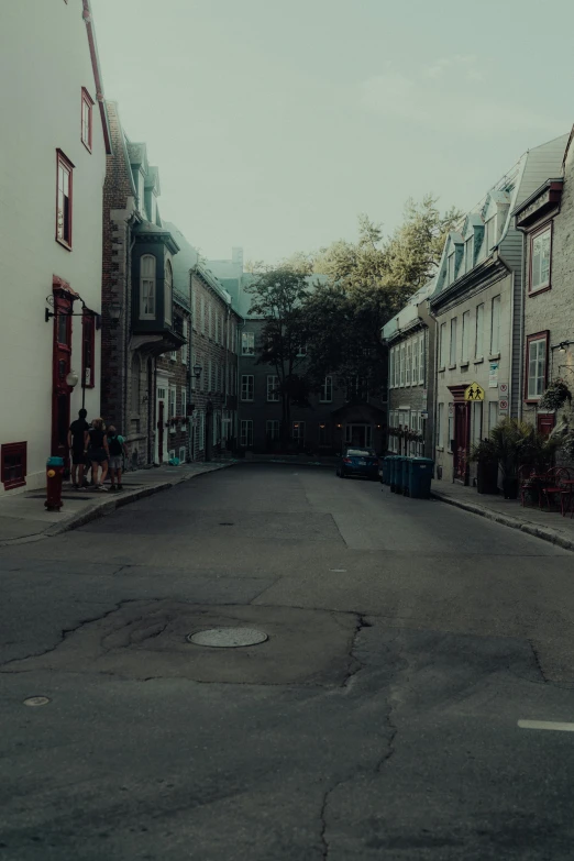 empty street with cars parked in the alley