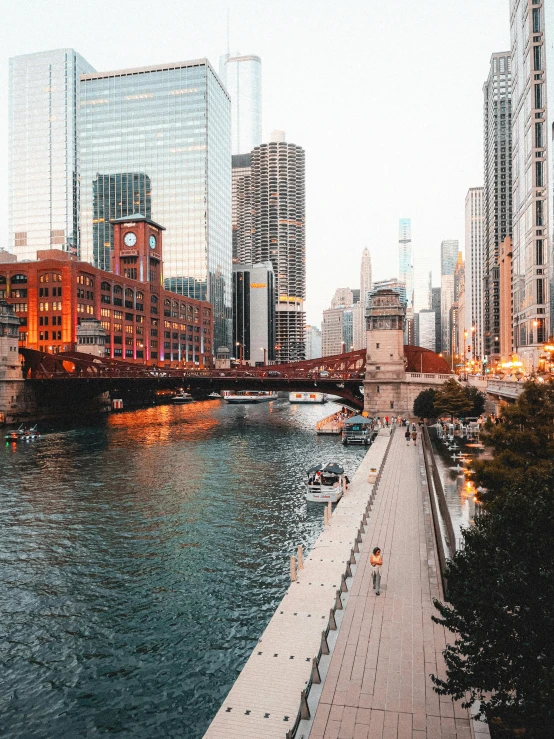 cityscape of the chicago river with traffic passing by in an overcast day