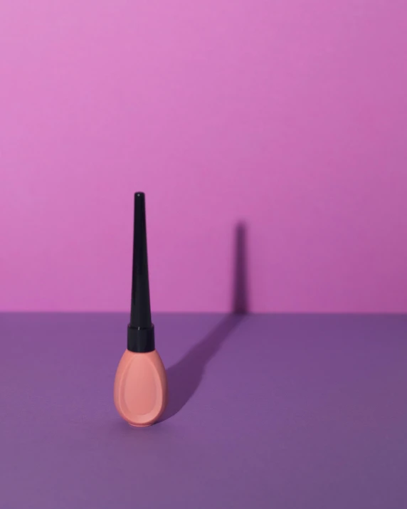 an image of pink makeup on a purple table