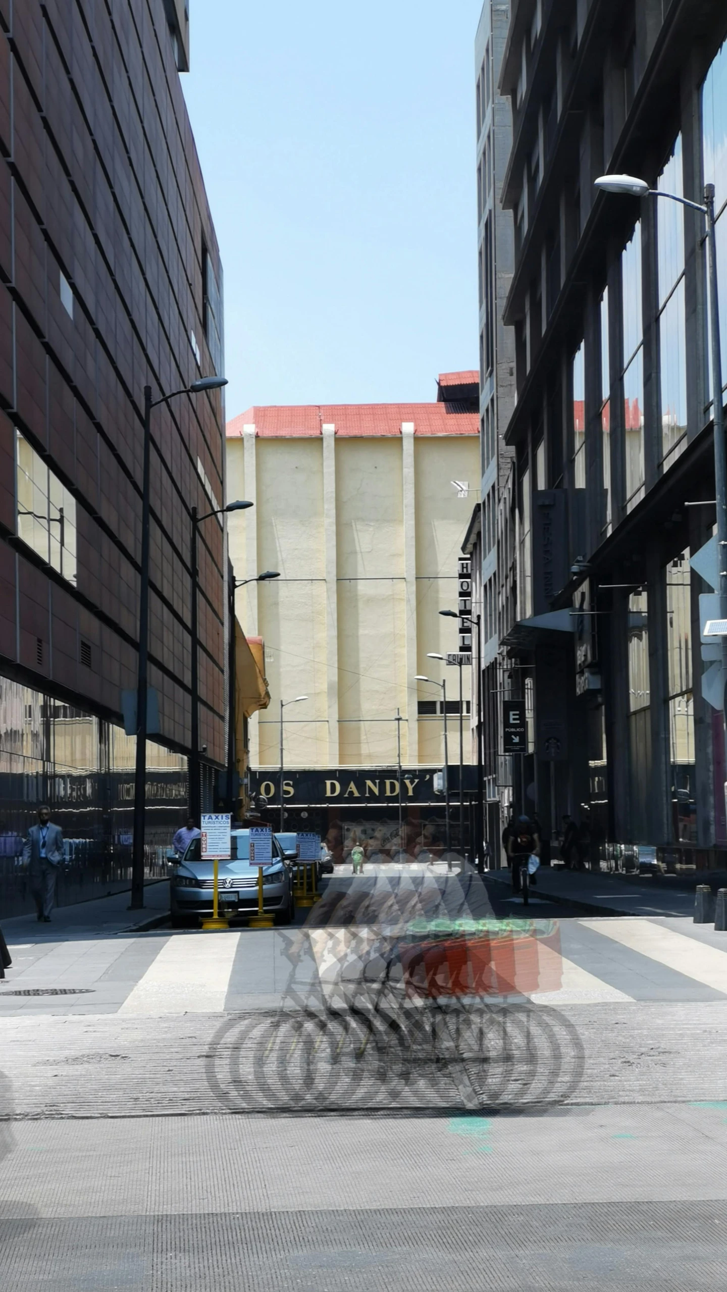 this po shows people walking down a city street