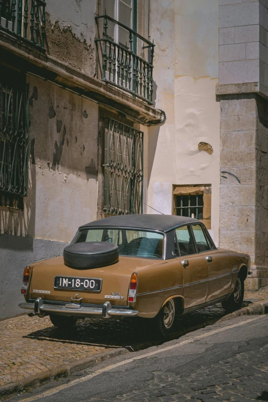 an old car parked on the side of a road