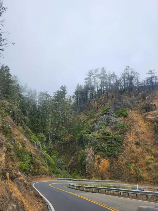 a large paved highway on the side of a steep hill