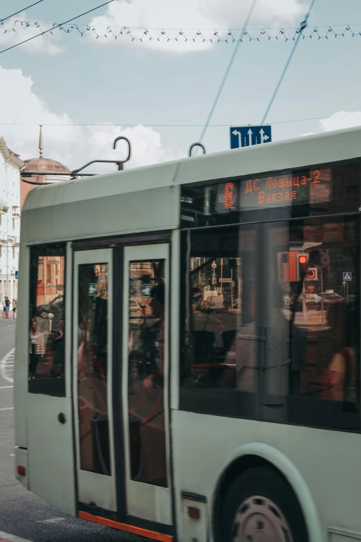 a bus driving down a street near an intersection