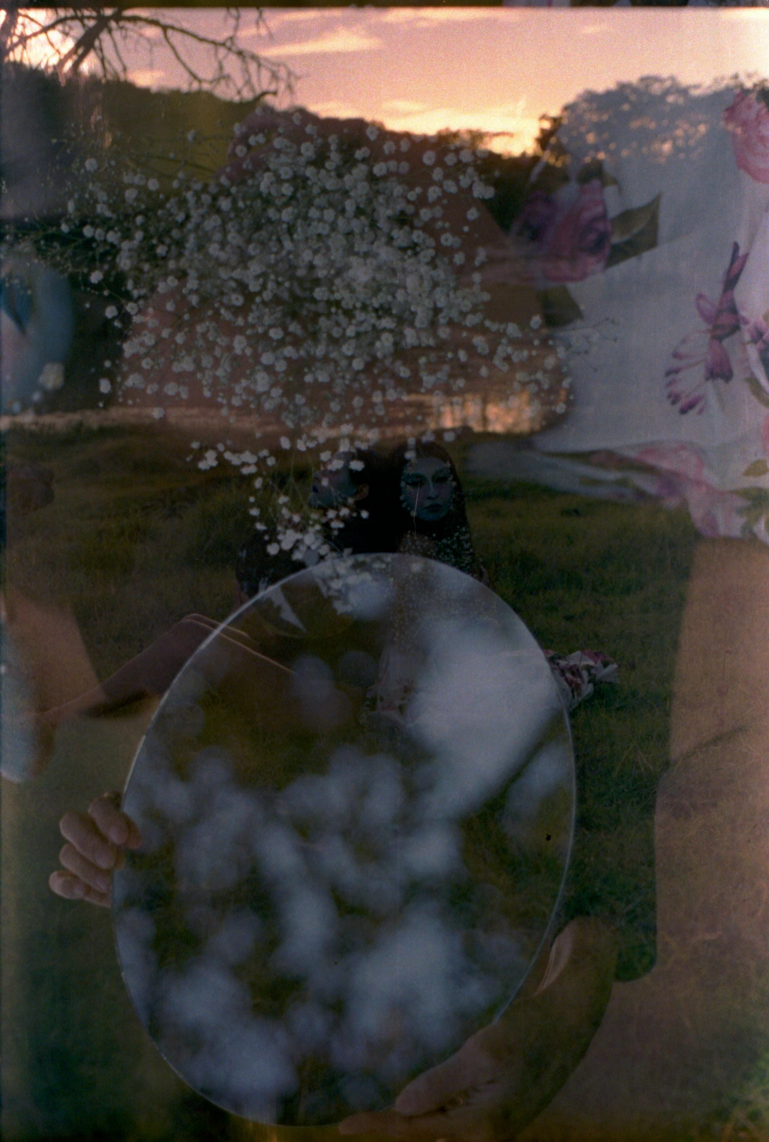 reflection in glass of man carrying plate with flowers