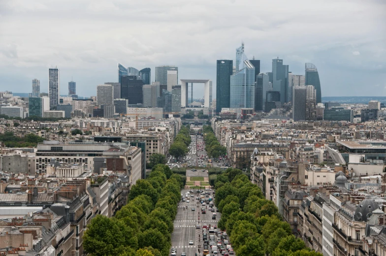 an aerial view of paris with tall buildings in the background