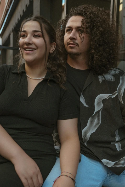 a man and woman sitting next to each other