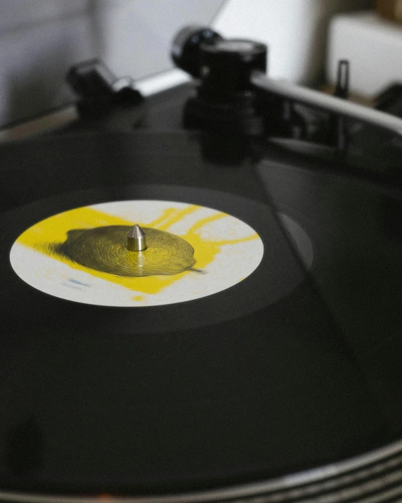 a turntable that has yellow paint on it