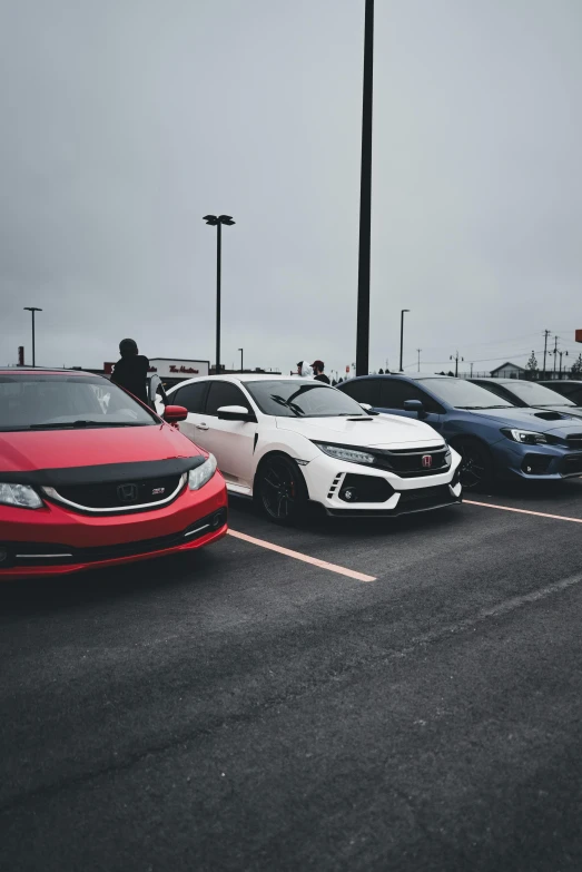 a group of cars that are in a lot