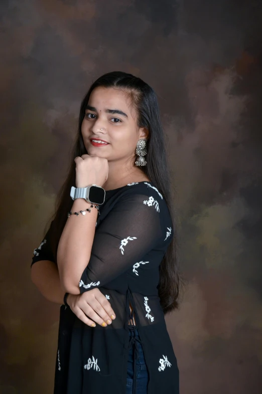 a young woman poses in her own studio