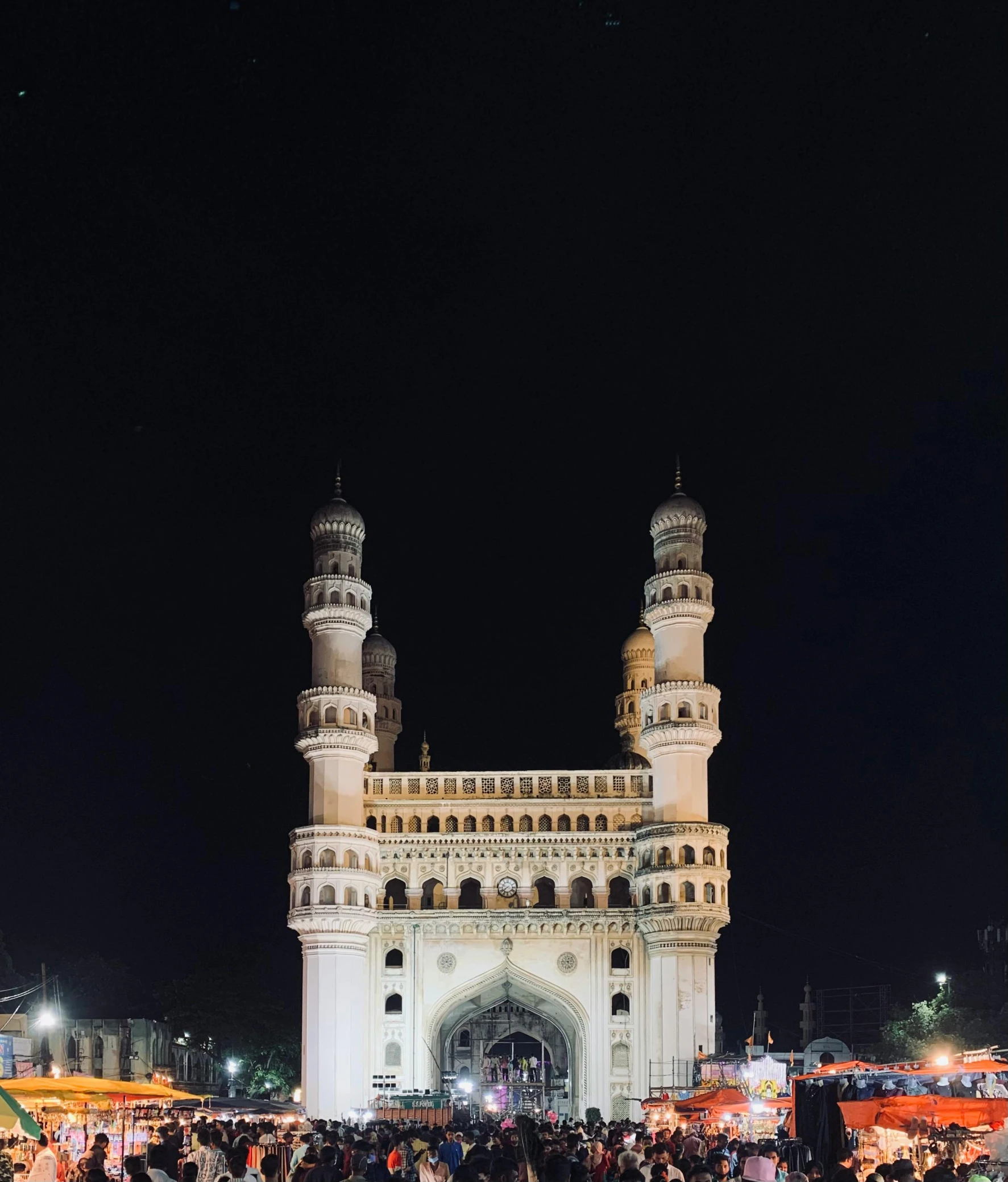 there is many people standing in front of the entrance