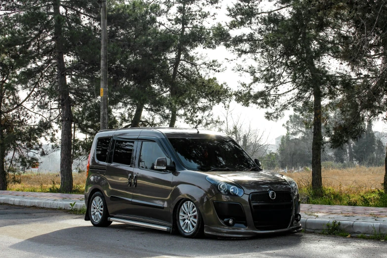 a very nice looking van parked by the curb