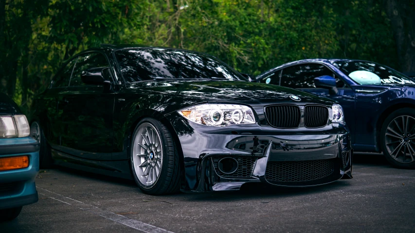 two cars sitting next to each other near one another