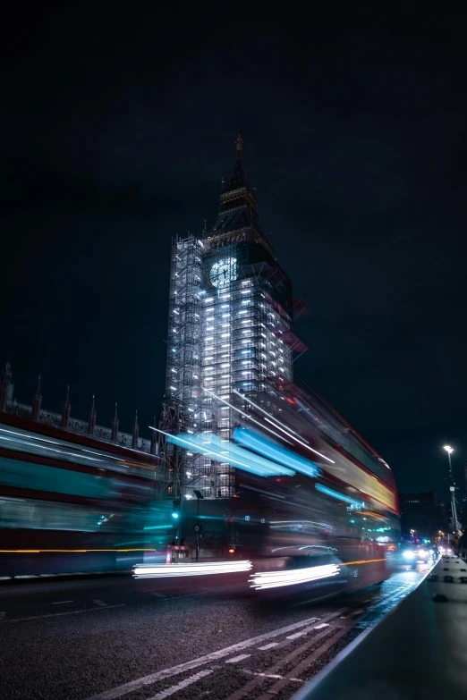 a building with lights in the middle of it and night