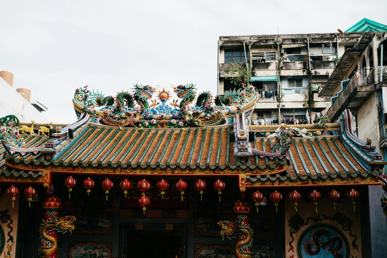 a close up of a building with decorations on the roof