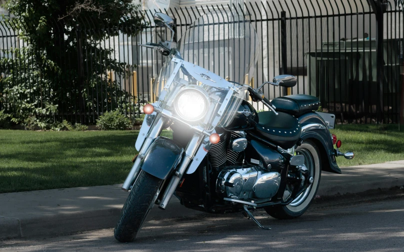 a motorcycle parked in front of a building on the side of a road