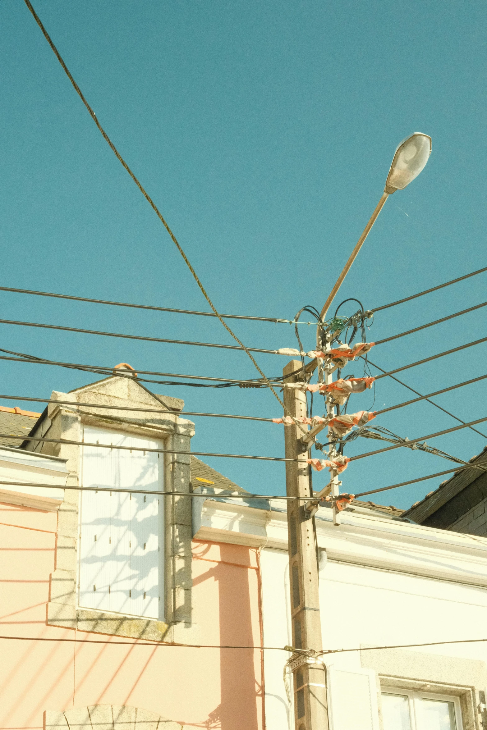 a lamp is on the side of a building