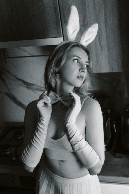 black and white pograph of a woman wearing bunny ears