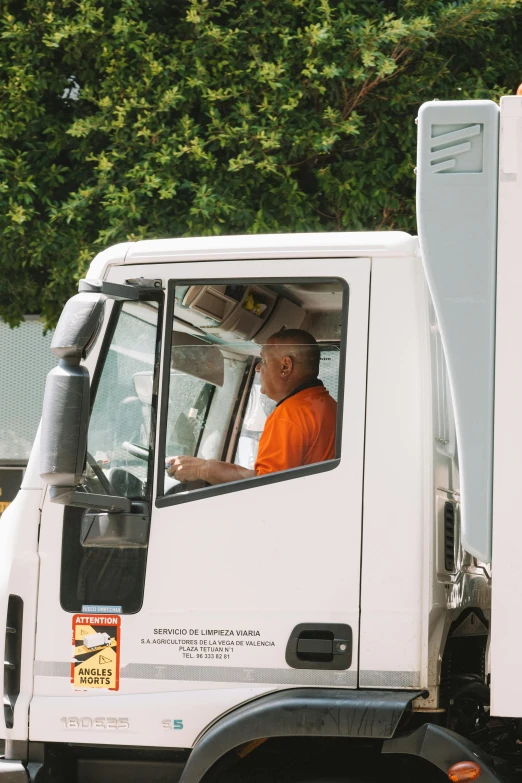 a truck driver is seated in the drivers seat