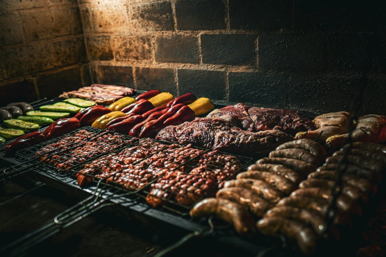 several barbecue grills cooking meats and pickles on racks