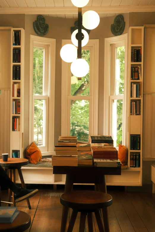 a wood table and two chairs in a room