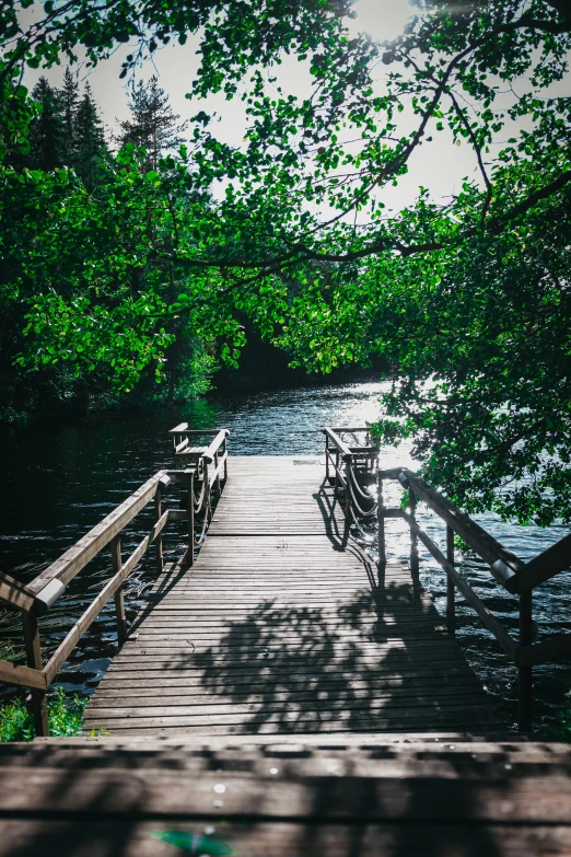 a wooden walkway extends into some deep water