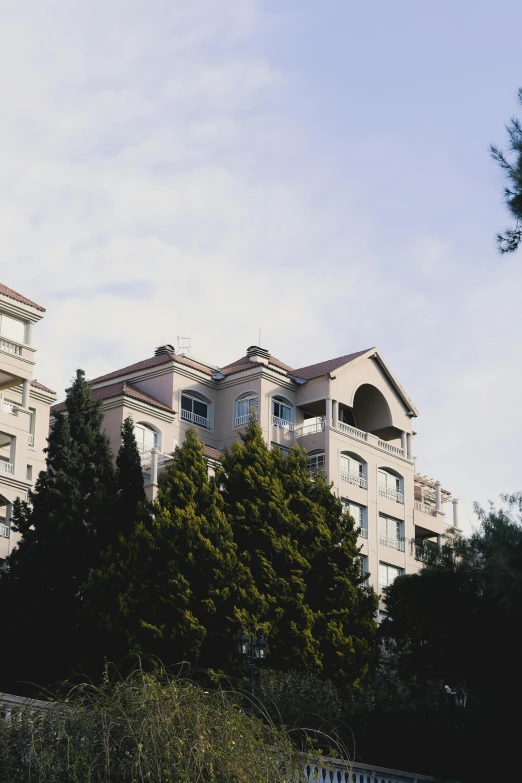 apartment buildings overlooking a park on a hill in the city