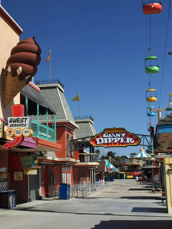 colorful carnival signs over shops lining the street