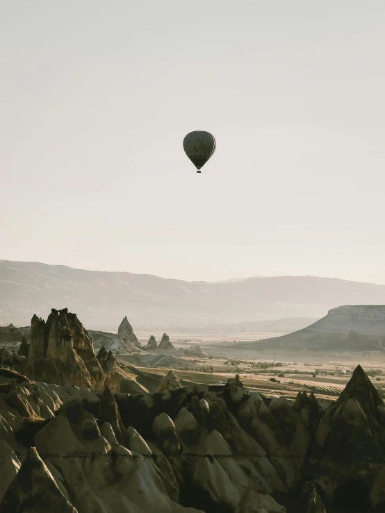 there is a  air balloon flying through the sky