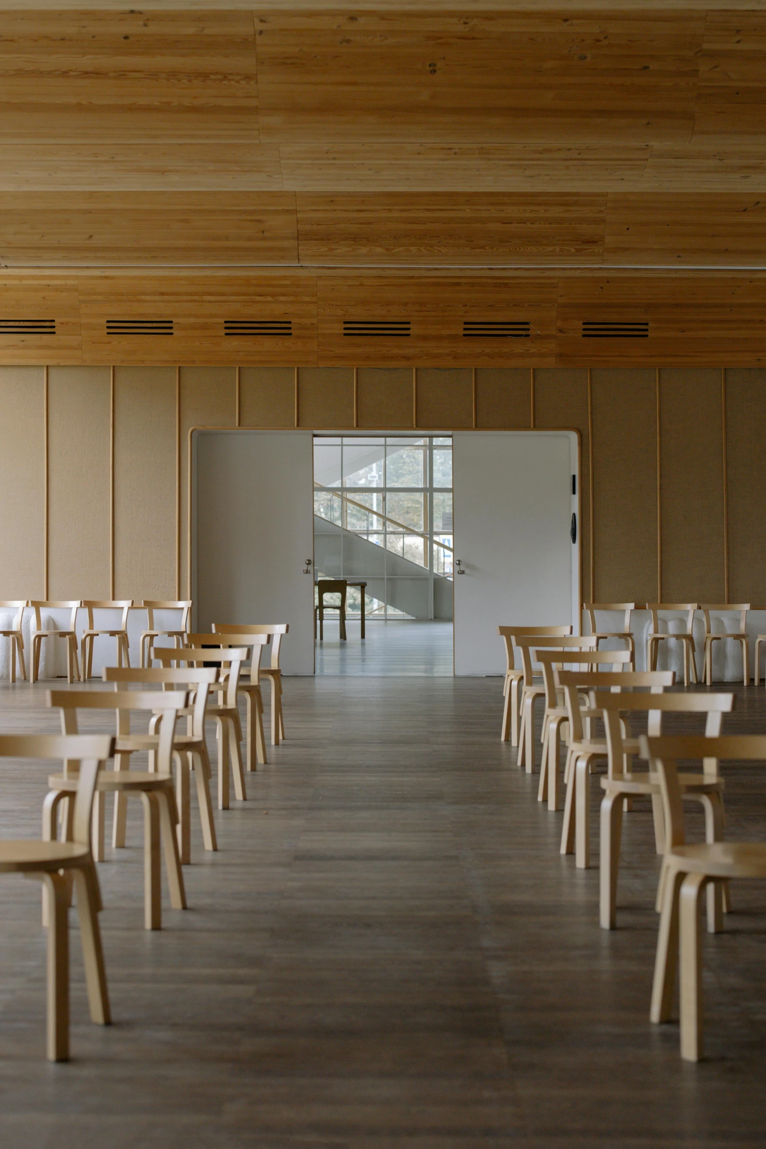 a restaurant area with tables and chairs next to the windows