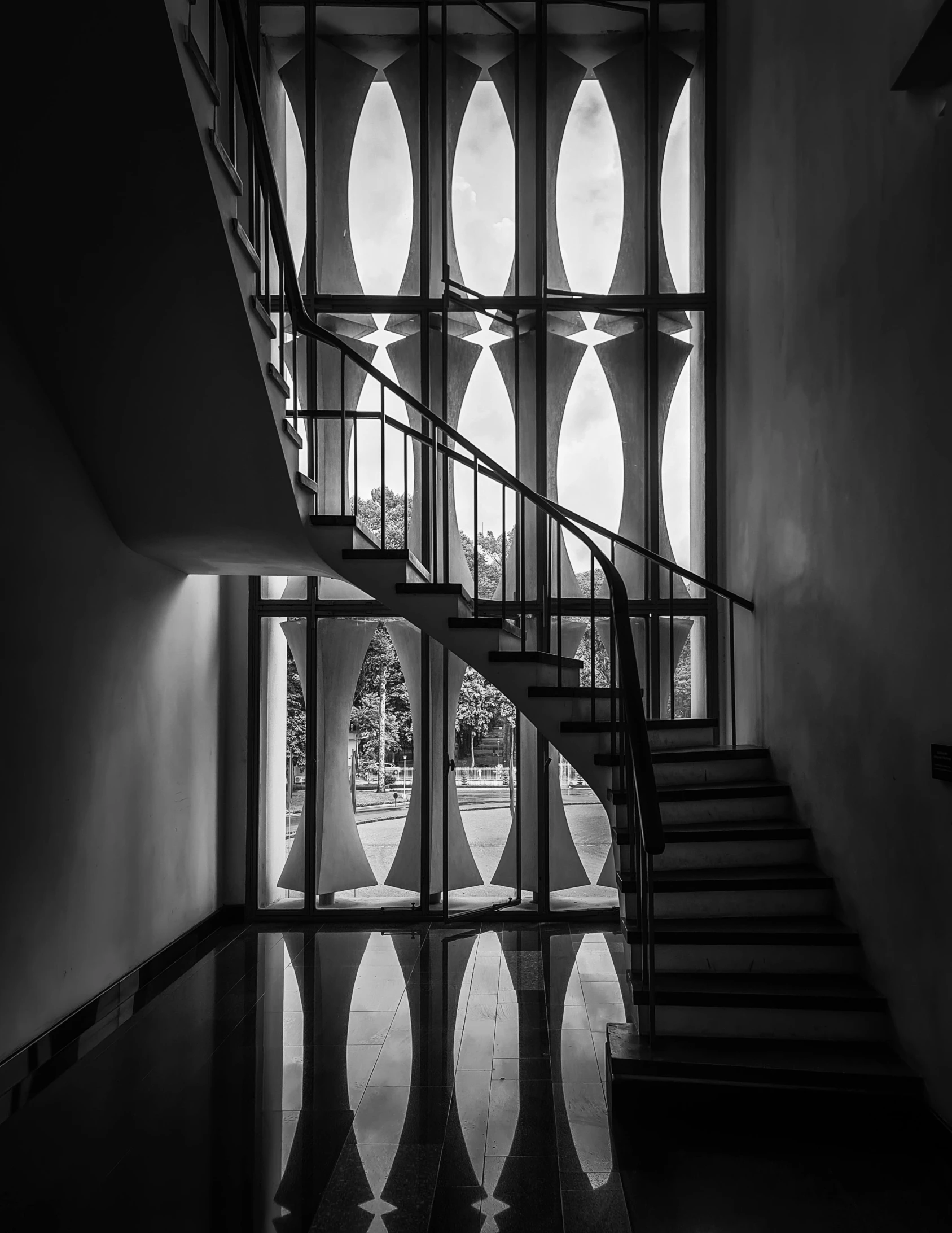 a long stairwell with a staircase next to it