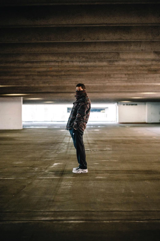 a man is skateboarding in an empty parking lot