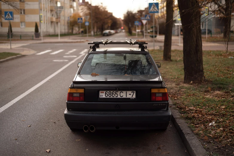 car parked in street in residential area of urban setting