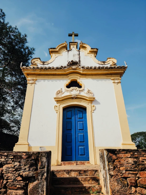 a building with blue doors sitting under a blue sky