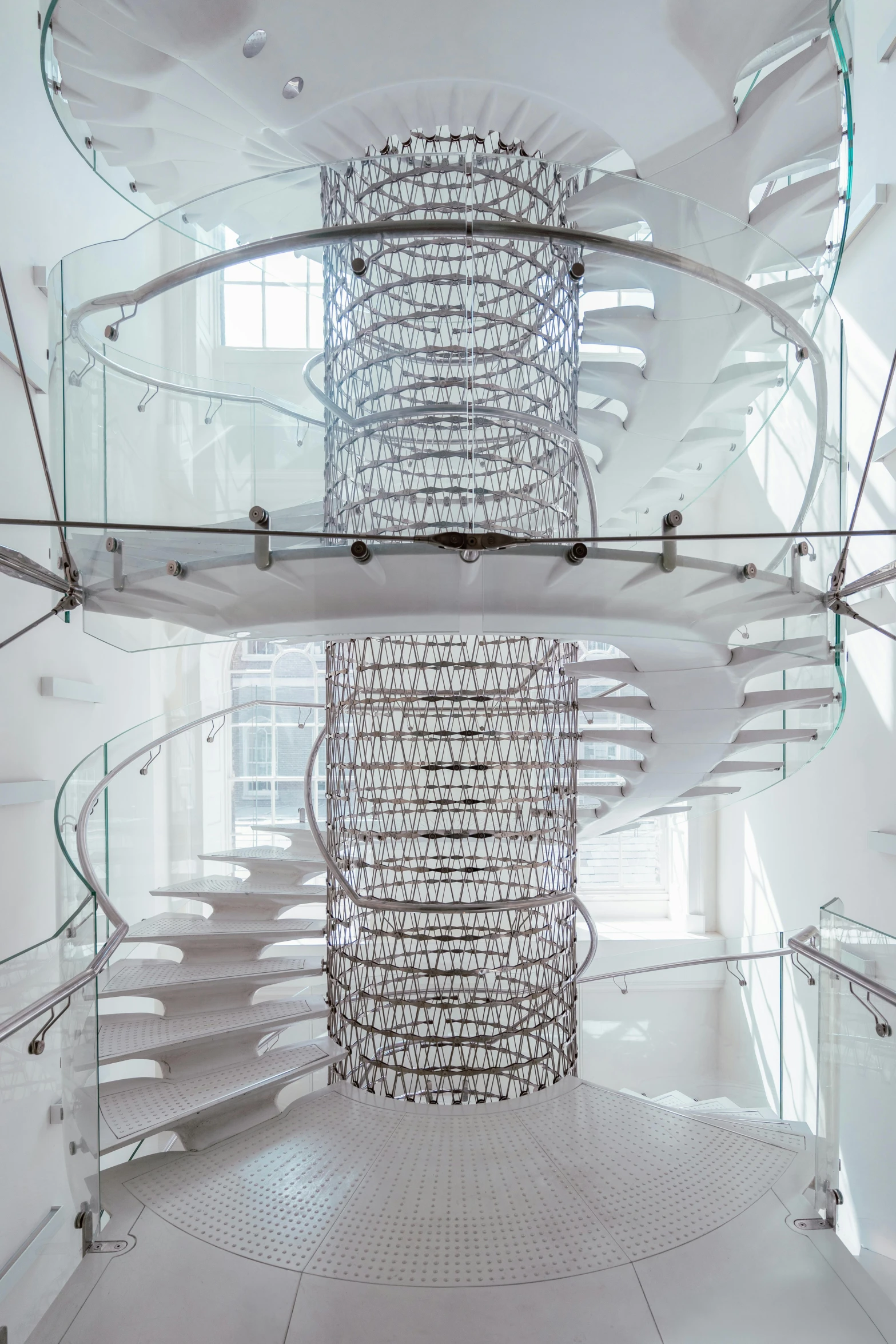 an ornate spiral staircase at a modern building