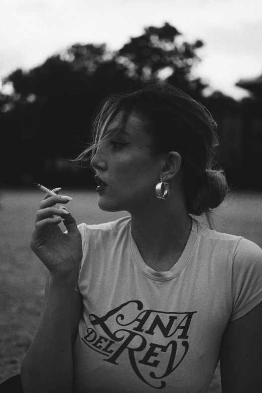 black and white po of woman smoking a cigarette