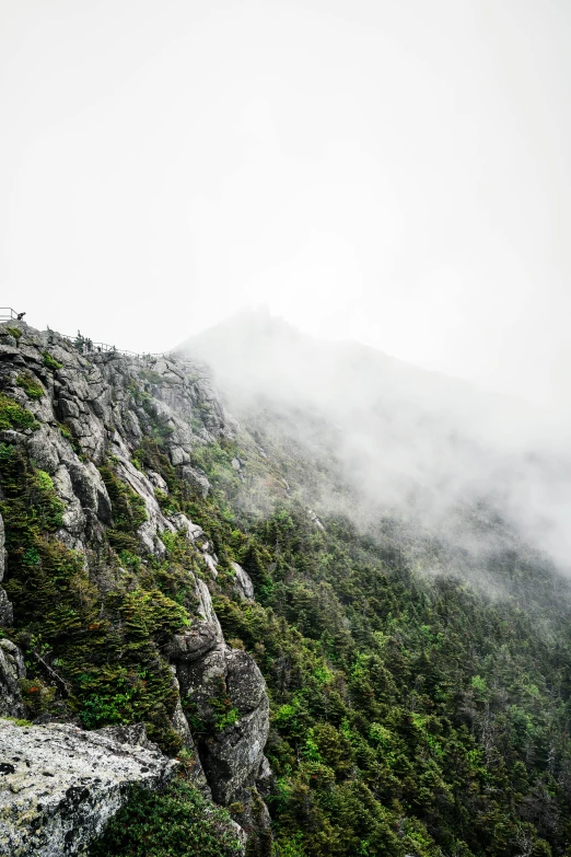 fog in the mountains rising up into the air