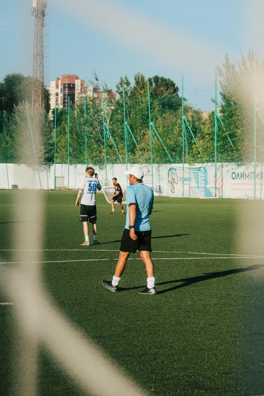 two players are on the soccer field playing