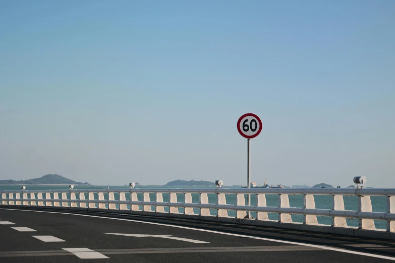 a road near a bridge that reads 80