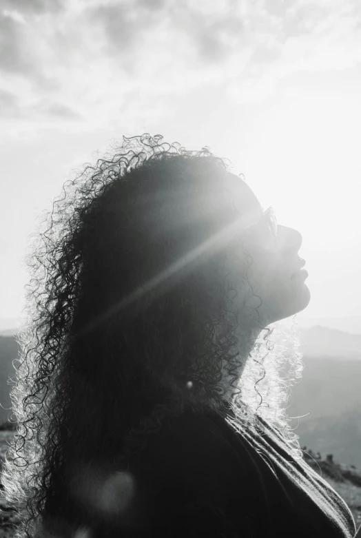 woman looking at sky on a sunny day