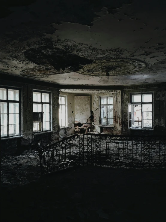 an image of a very dark room that is in disrepair