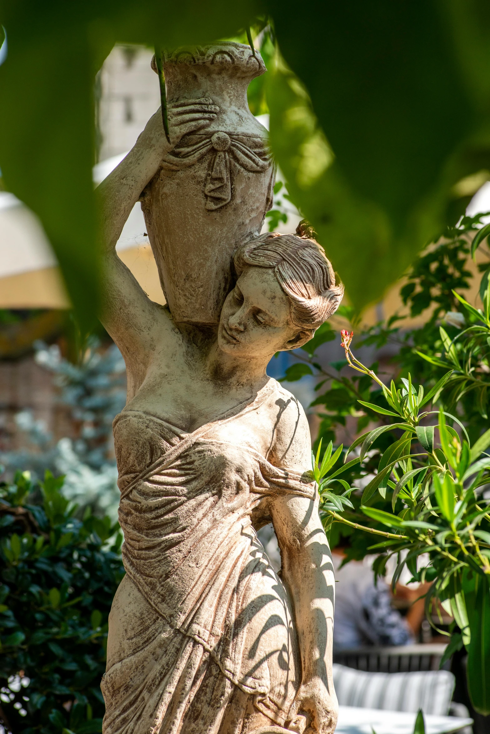 the statue of a woman with her hair blown by wind