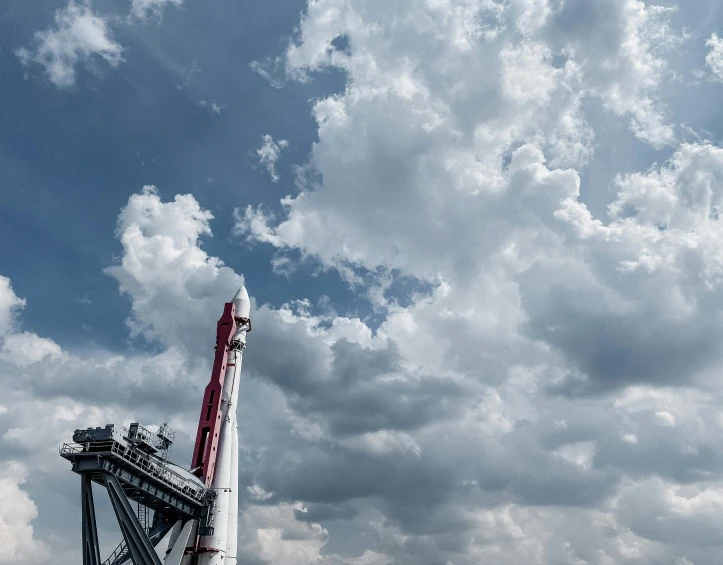 a small rockets on display on a cloudy day