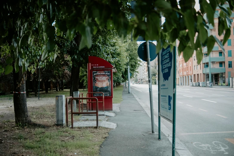 a street corner with several signs in front of it