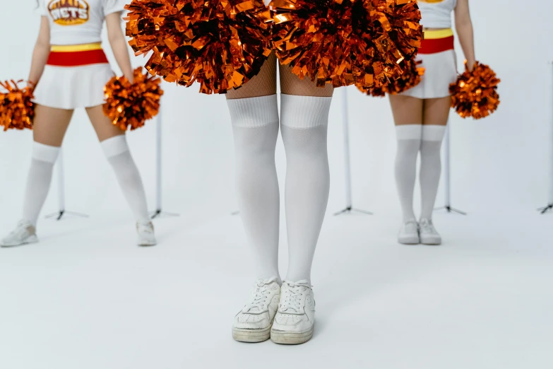 the cheerleaders are posing with their pom poms