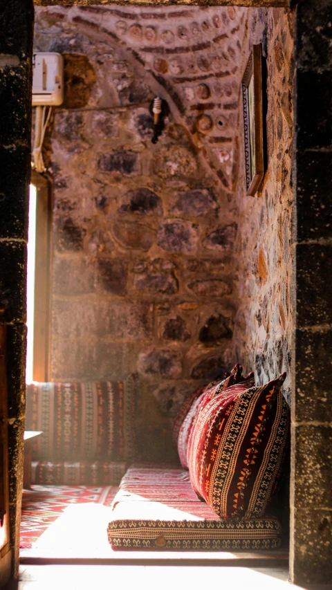 an open brick door with the light coming in from inside